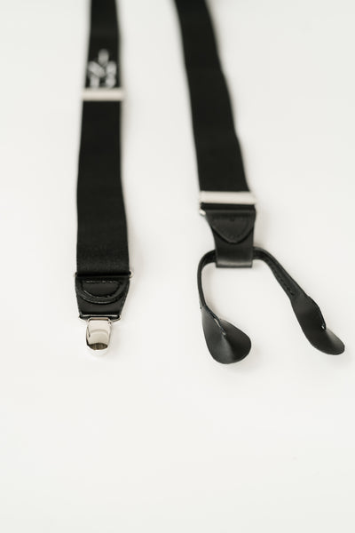 close up of button end verses clip on suspender